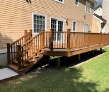 Rear deck with a short stair run leading to the yard