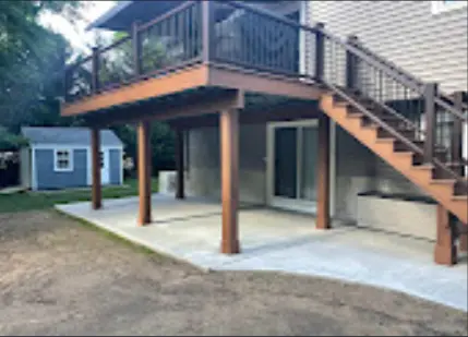 Elevated deck with black railing and exterior stairs