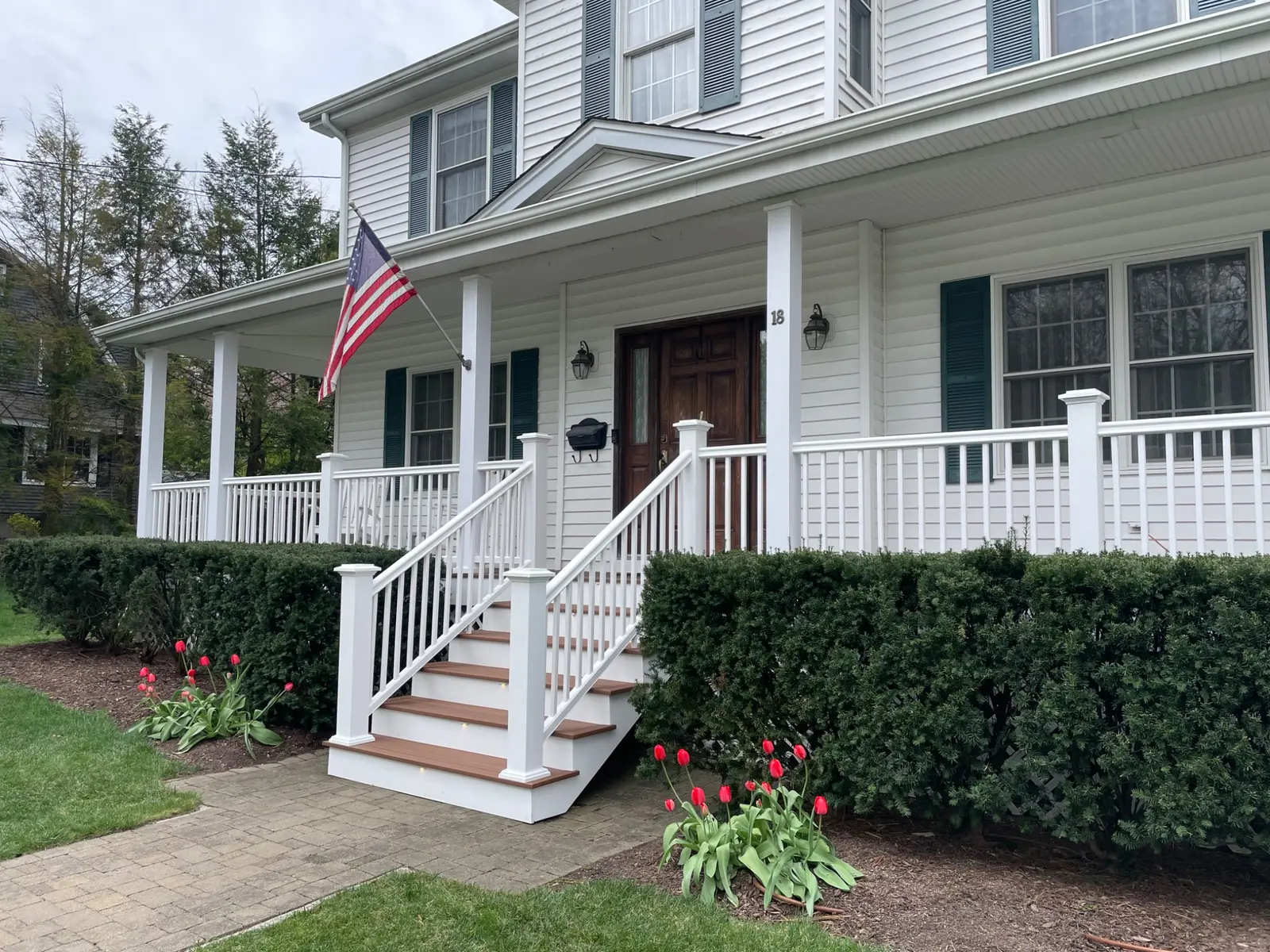 Finished composite front stairs with white railing
