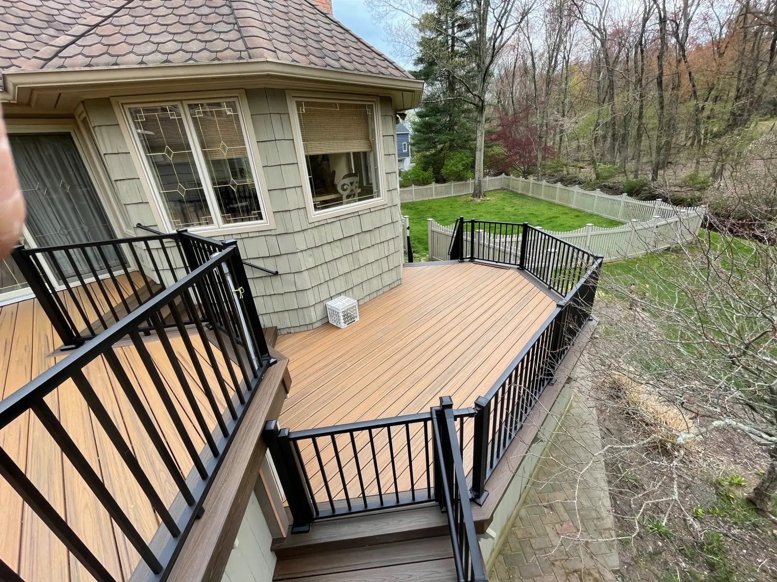 Completed deck levels, stairs and black railing