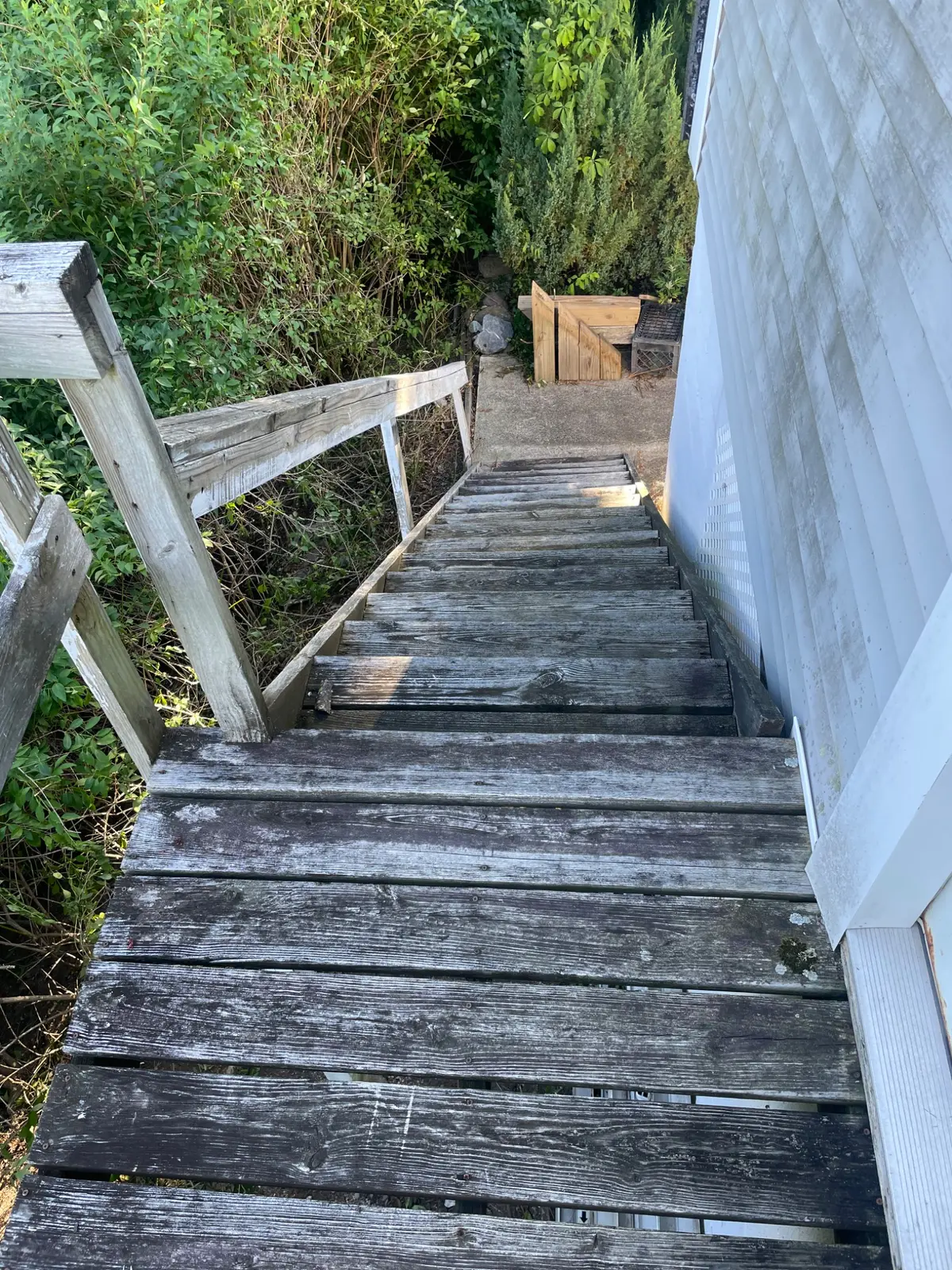 Weathered stairway and upper platform before replacement