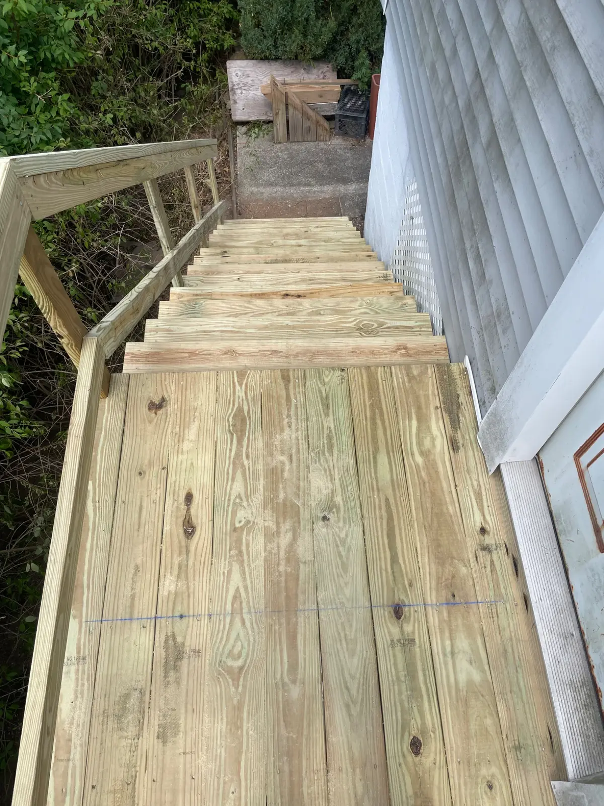 New pressure-treated stairway and platform viewed from above
