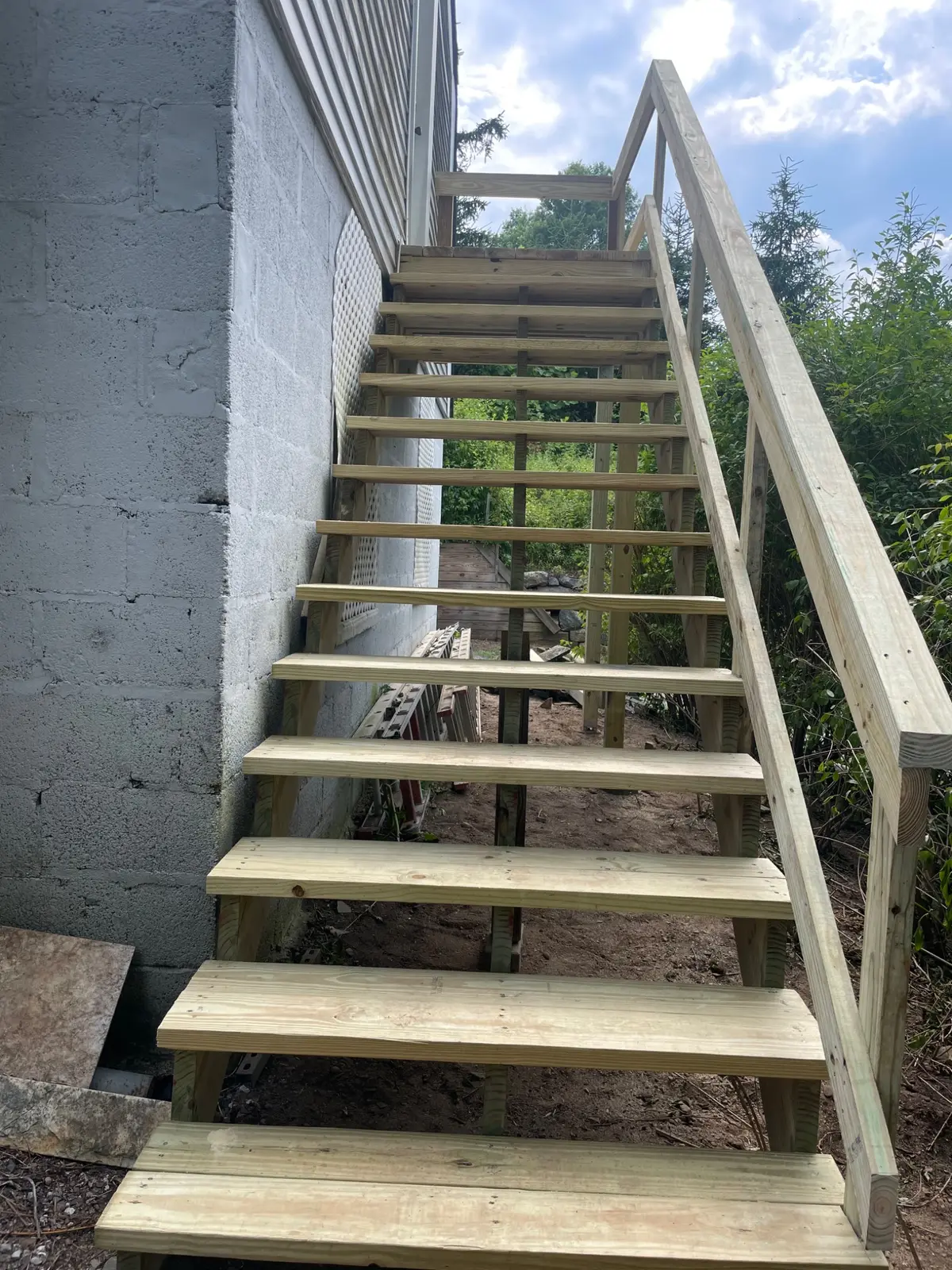 New pressure-treated stairway viewed from below