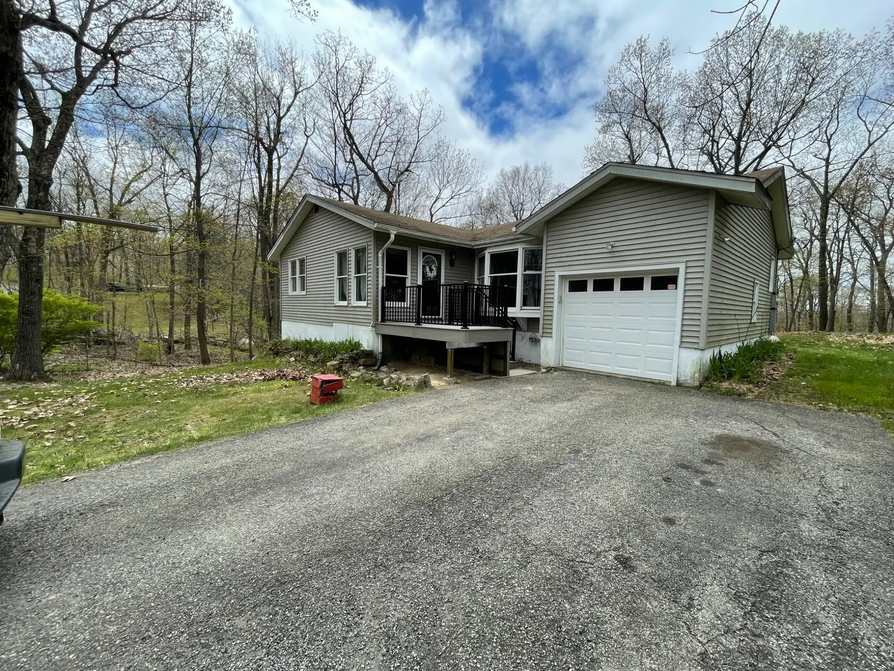 Small composite entry deck beside a garage